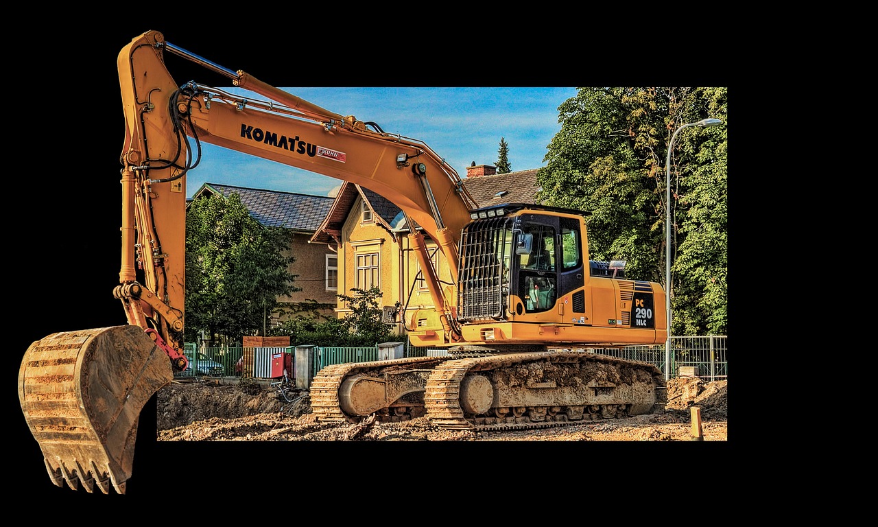 Excavator grading a site in the Waco area